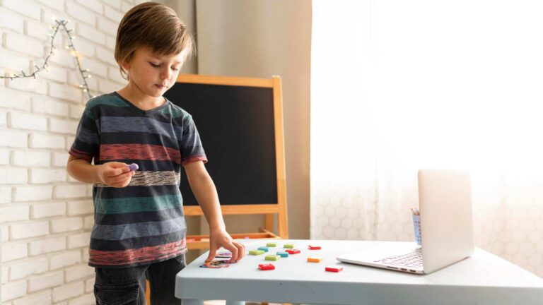 A child arranging shapes on an autism level 1 diagnostic evaluation