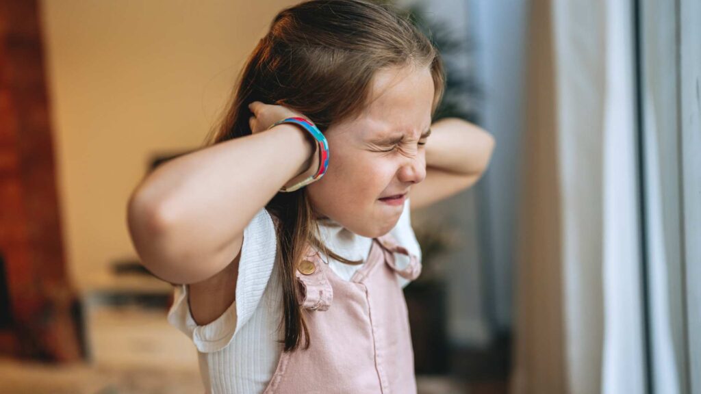 Girl experiencing sensory sensitivity