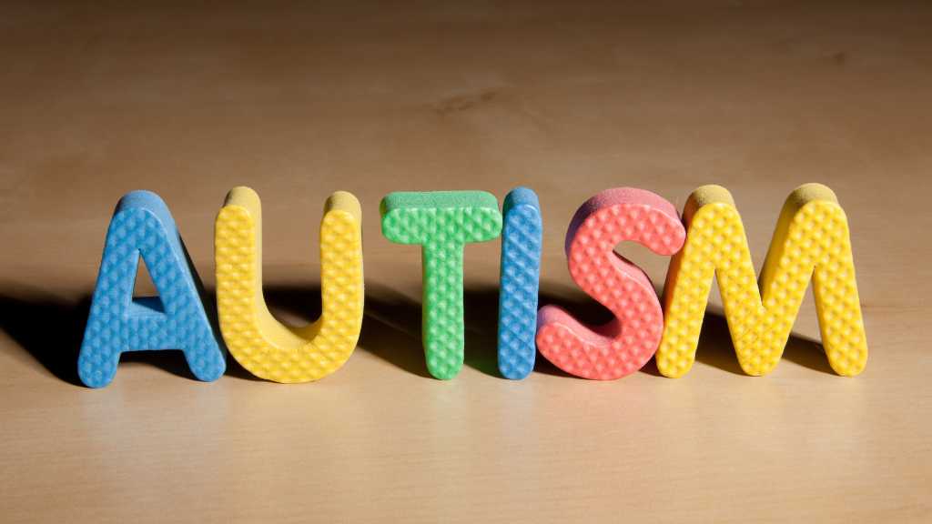 Colorful foam letters spelling “autism” representing undiagnosed autism and the challenges of delayed diagnosis.