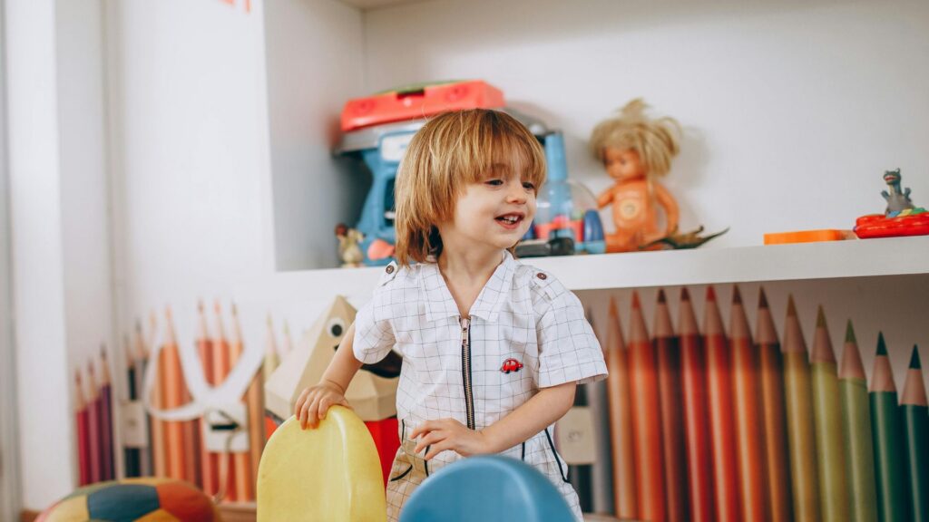Young child playing in a colorful learning environment